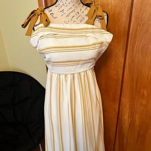 Selling lot of 3 outfits, 2 dresses and 1 romper.